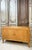 Sycamore veneer sideboard from the 1930s-40s. It opens with two doors and bronze knobs. The semicircular uprights...