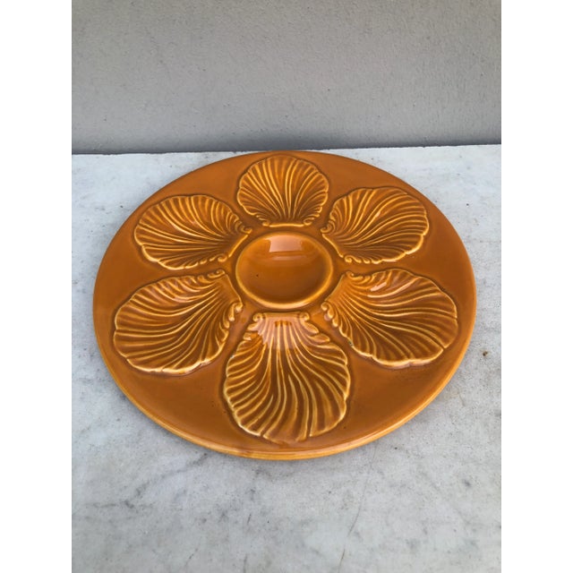 French orange Majolica oyster plate signed Proceram, circa 1950.