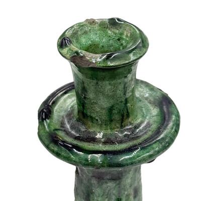 A Moroccan Tamegroute glazed candlestick holder is a handcrafted piece made in the historic pottery village of Tamegroute...