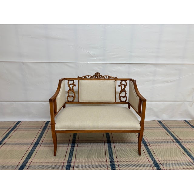 Antique Edwardian-style double chair-back settee ,dating roughly from the early 1900s to 1910s. Carved and polished...