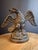 For sale is a 1920s–1930s Early American cast iron doorstop depicting a bold American Bald Eagle perched atop a rocky...