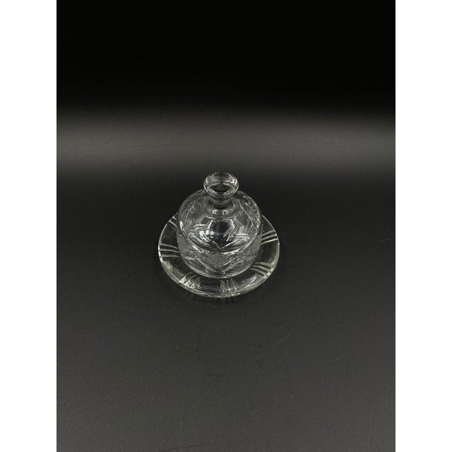 Vintage-style butter dish with lid, crafted from high-quality crystal glass. The butter dish features a domed lid with a...