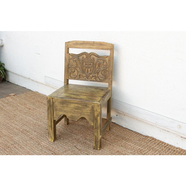 This 36-inch accent chair is a rare architectural find, showcasing the intricate woodcarving traditions of 19th-century...