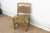 This 36-inch accent chair is a rare architectural find, showcasing the intricate woodcarving traditions of 19th-century...