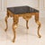 Make a sophisticated statement with this substantial French-style side table, featuring a square black marble top and an...