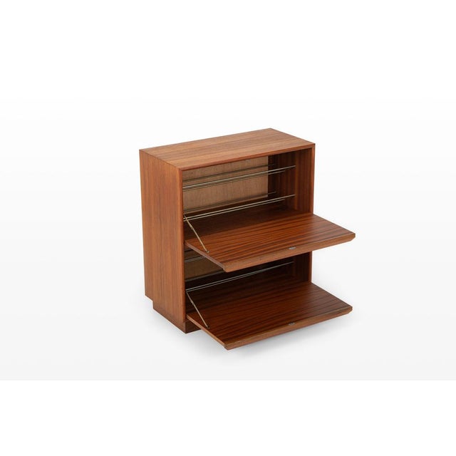 Functional danish shoe cabinet produced by g.v. Møbler in the 1960s. Crafted in warm teak, this piece reflects the clean...