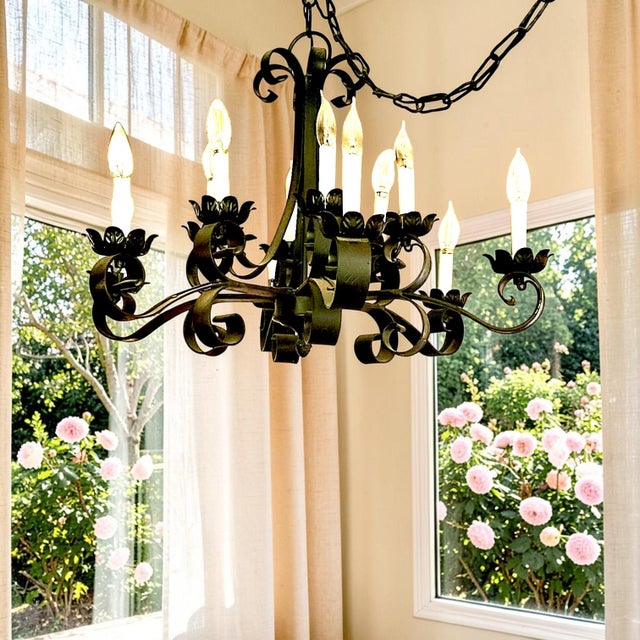 These custom antique lighting fixtures are Spanish Revival style wrought iron chandeliers, characterized by heavy forged...