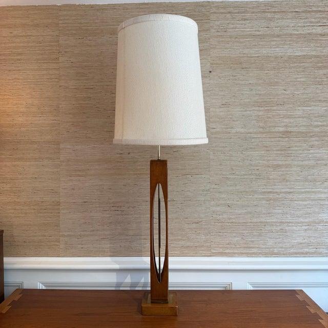 Mid-century modern walnut table lamp by Modeline with enamel and burlwood panel detailing, designed by John Keal in 1959....