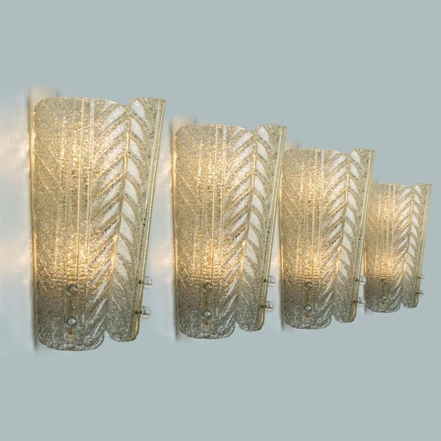 Wonderful high-end wall sconces in the style of barovier. With 3 long curved glass 'leaves' and brass details giving this...