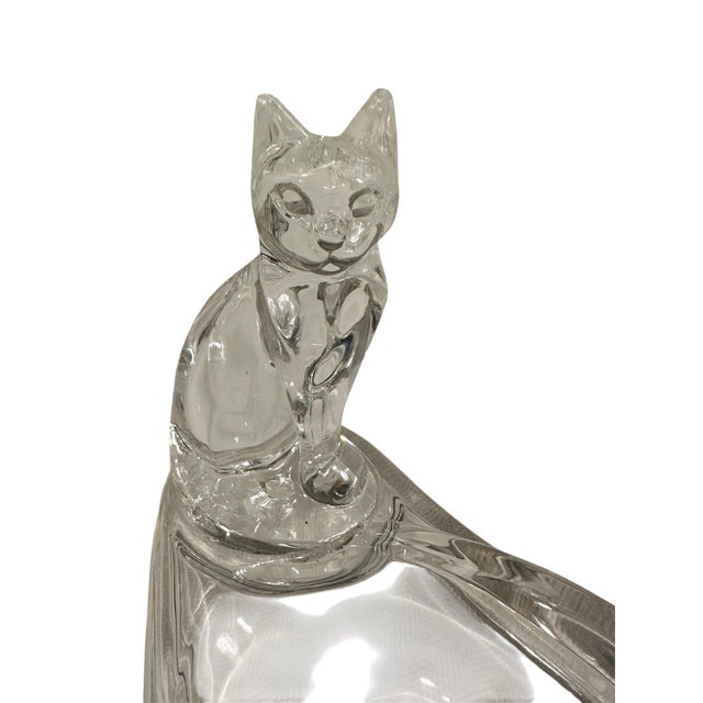 A charming, mid century lucite valet. Features a clear, lucite catchall accented by a quirky cat. Unmarked. Circa 1970.