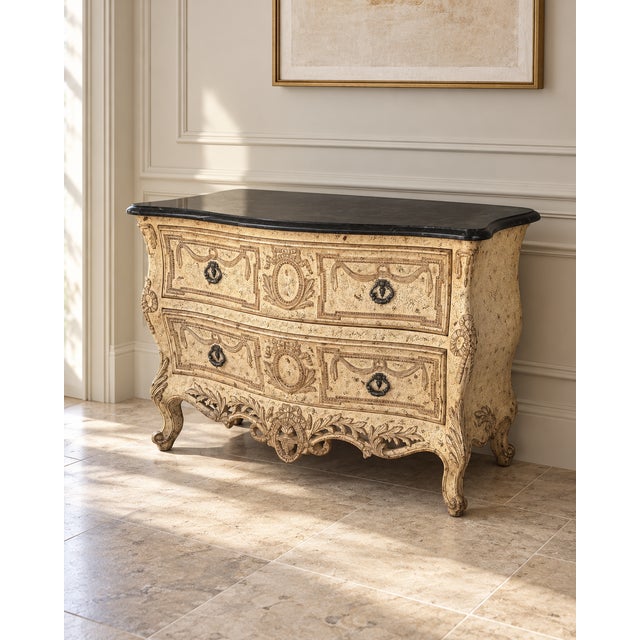 An elegant French Provincial-style console table showcasing an ornate, sculptural silhouette inspired by classic Louis XV...