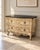 An elegant French Provincial-style console table showcasing an ornate, sculptural silhouette inspired by classic Louis XV...