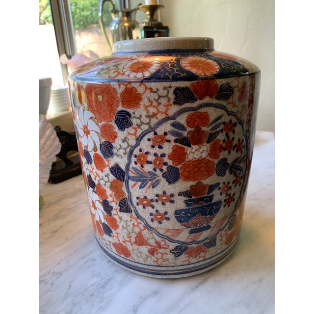 Here we have a beautiful vintage Asian porcelain jar or vase. Hand painted florals in gorgeous shades of orange, blue,...