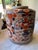 Here we have a beautiful vintage Asian porcelain jar or vase. Hand painted florals in gorgeous shades of orange, blue,...