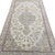 This beautiful antique rug features a graceful floral composition centered around a delicate central medallion. The design...