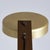 Desk lamp with a brown painted metal frame and a gold aluminum shade that matches other details of the lamp. The shade is...