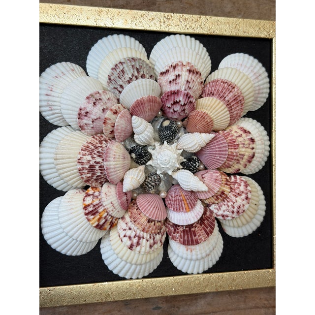Charming custom seashell wall art inspired by traditional sailor’s valentines, featuring a beautifully arranged radial...