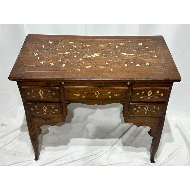 Antique 18th C Italian writing desk with bone marquetry. Intricate floral and bird motifs. Five drawers and tapered legs....