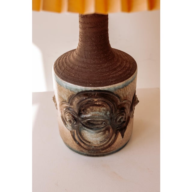Vintage ceramic table lamp by the Danish maker IB Oluf Hansen. The base has a cylindrical shape, crafted from brown...