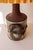 Vintage ceramic table lamp by the Danish maker IB Oluf Hansen. The base has a cylindrical shape, crafted from brown...