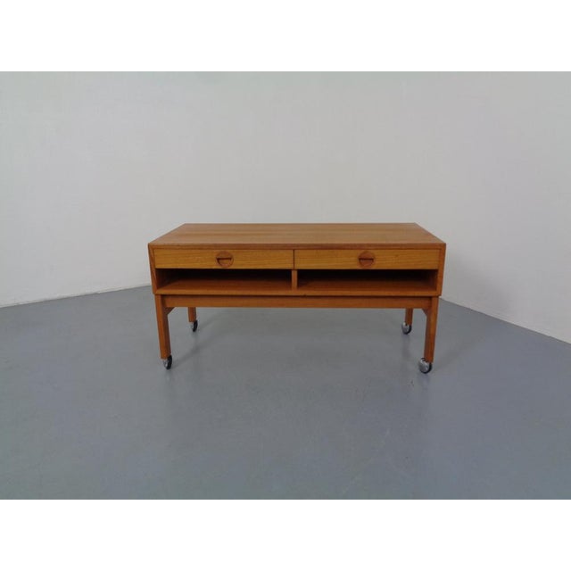 Danish teak chest of drawers on wheels by Rud Thygesen & Johnny Sorensen for HG Furniture. Equipped with two drawers. This...