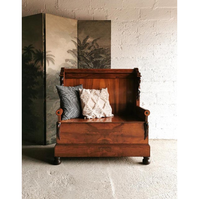 This wooden bench dates back to the 1890s and was used in the lobby of a Belgian wool factory. It is designed in the...