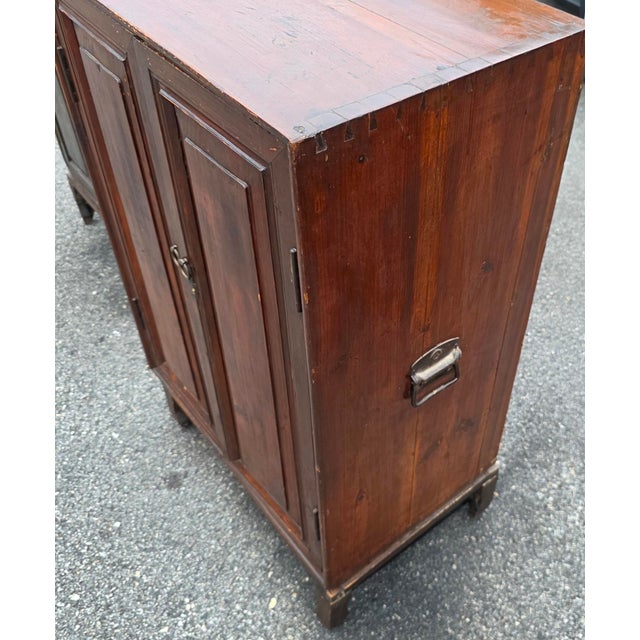 This charming antique Spanish Colonial armario is crafted from solid pine and elevated on a separate four-legged stand,...