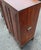 This charming antique Spanish Colonial armario is crafted from solid pine and elevated on a separate four-legged stand,...