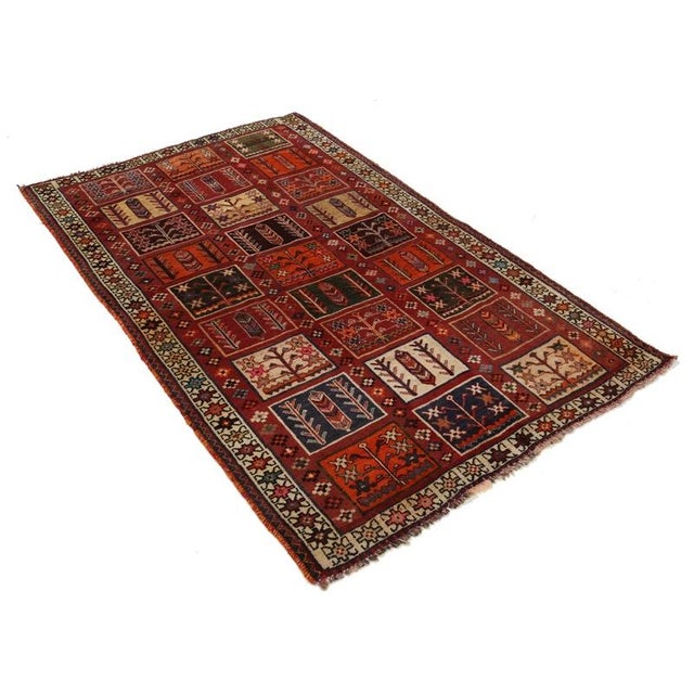 Offered is a gorgeous Persian Bakhtiari area rug. The luxurious hand-knotted pile is made from very fine lamb's wool and...