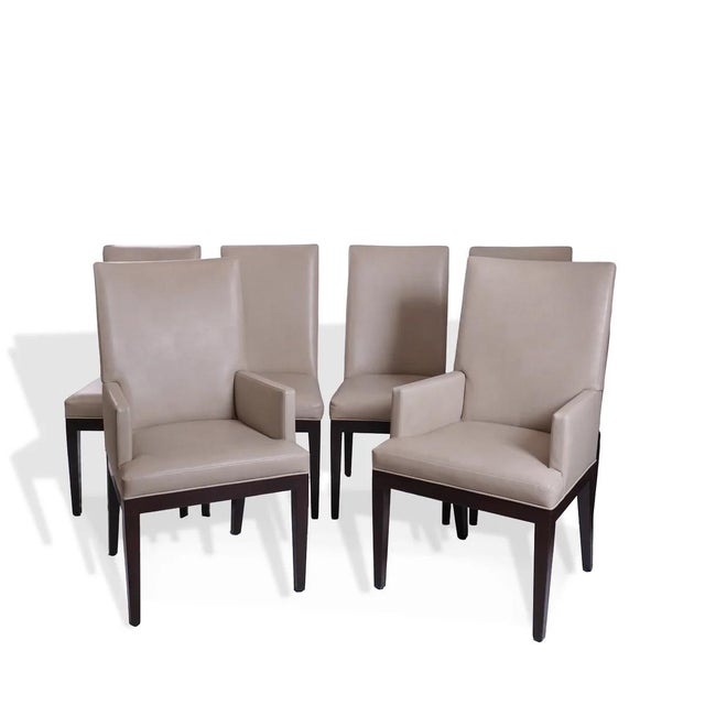 This set of six dining chairs is tailored for refined, contemporary interiors, featuring clean architectural lines and the...