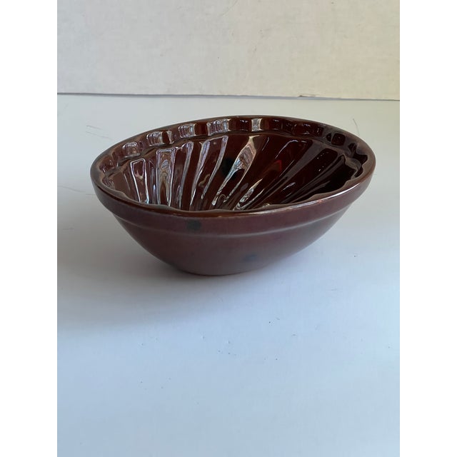 Beautiful brown pottery pudding mould. Signed on reverse "pottery by Kathy."