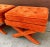 Vintage pair of tufted x style stools or ottomans. Rich orange colored fabric with a geometric pattern. Great upholstery...