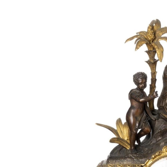 Table clock - 19th century. French, 19th/20th century; in gilded bronze; embossed and patinated with marble. White enamel...