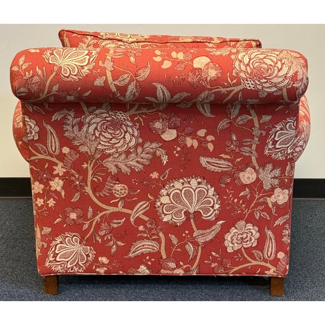 A classic Martha Stewart by Bernhardt armchair upholstered in rich rust-red fabric with an intricate cream and gold...