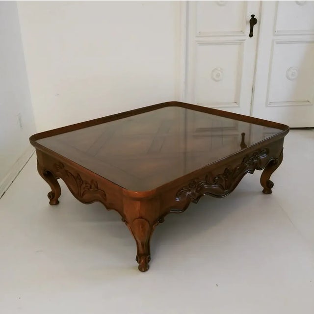 This beautiful table is from the 60s-70s. Its all hand built with walnut wood and deep flowers and leafs carved details on...