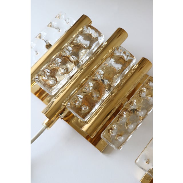 Pair of wall sconces attributed to Carl Fagerlund and produced by the prestigious Swedish lighting company Lyfa....