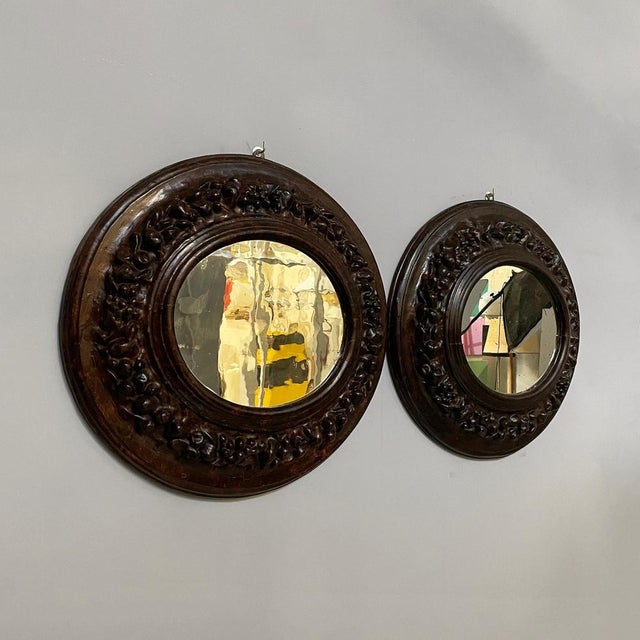 Italian Oval wall mirrors with papier-mâché frame, 1700s Pair of oval wall mirrors with finely crafted and decorated...