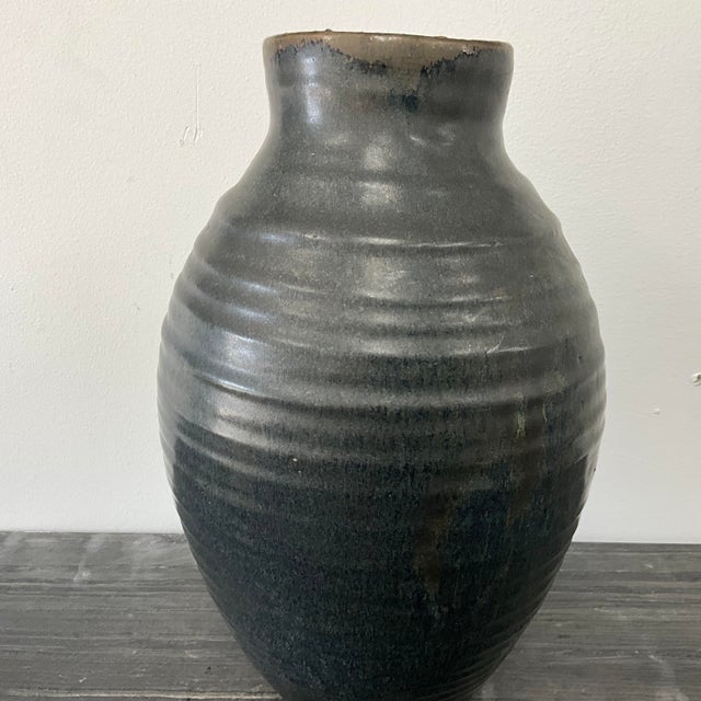 Unsigned Mid-Century Studio Pottery Vase with Drip Glaze, 14” H × 8” Dia Description Unsigned mid-century studio pottery...