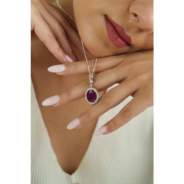 This elegant pendant features a 8.69 carat oval-cut ruby set in 14K white gold. The ruby measuring 13.2 x 10.5 mm,...
