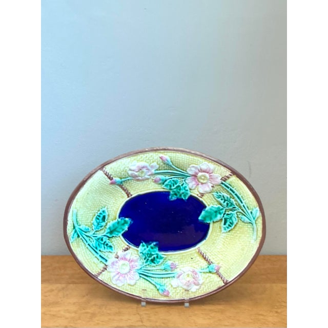 This exquisite vintage Majolica platter is a masterwork of botanical naturalism and artisanal glazed pottery, bringing the...