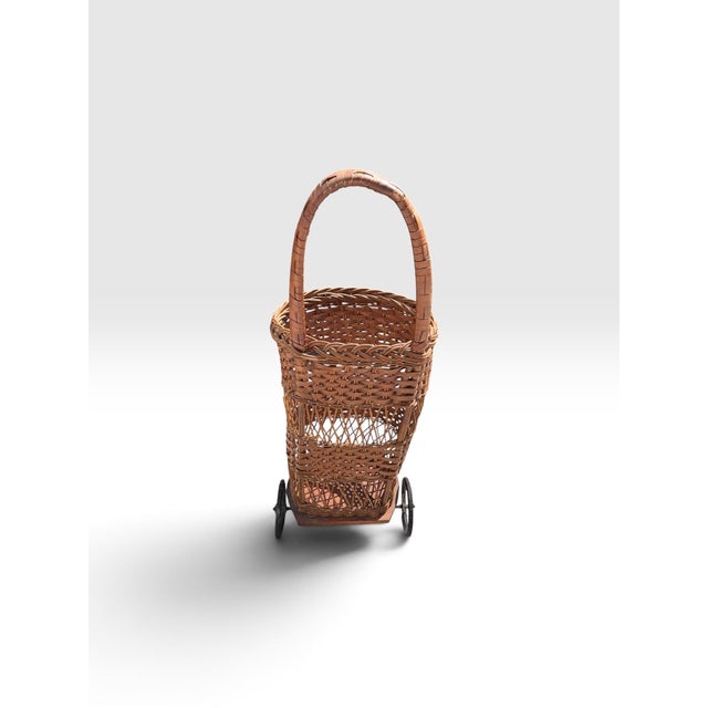 Early 20th Century Handwoven Wicker Rolling Market Basket With Iron Wheels For Sale In West Palm - Image 6 of 9