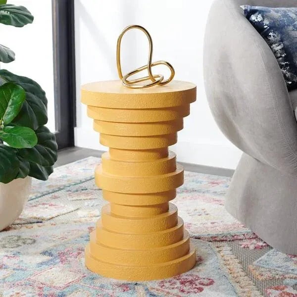 Add a graphic and striking accent to your home with our Ali Accent Table. Round discs are stacked together to attain a...