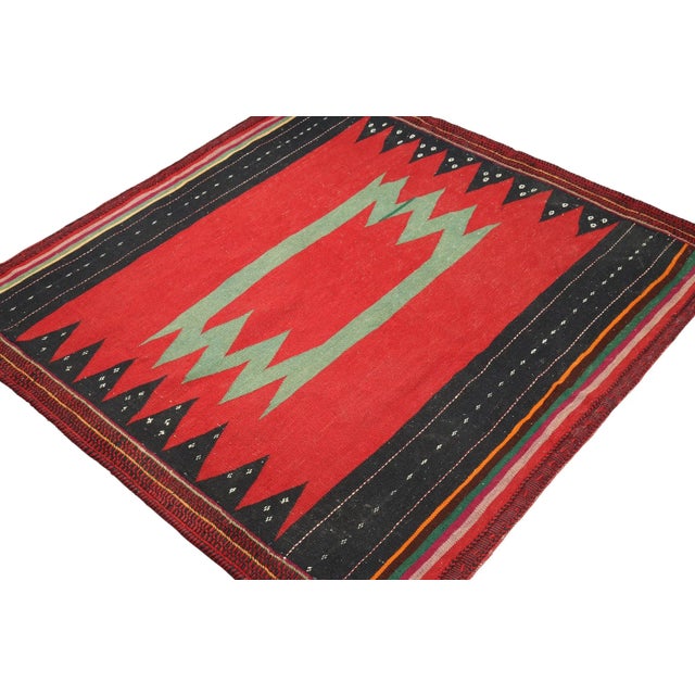 This vintage 4x4 square Persian kilim is a tribal Sofreh rug—handwoven in wool circa 1970-1980. Further on the Design:...