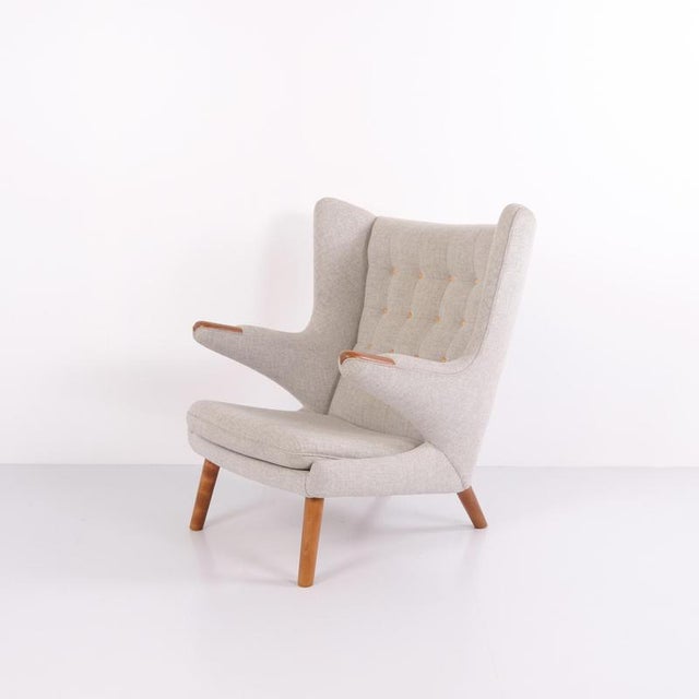 The papa bear chair, model ap19, designed by hans j. Wegner in 1951. Upholstered in light grey hallingdal fabric with...