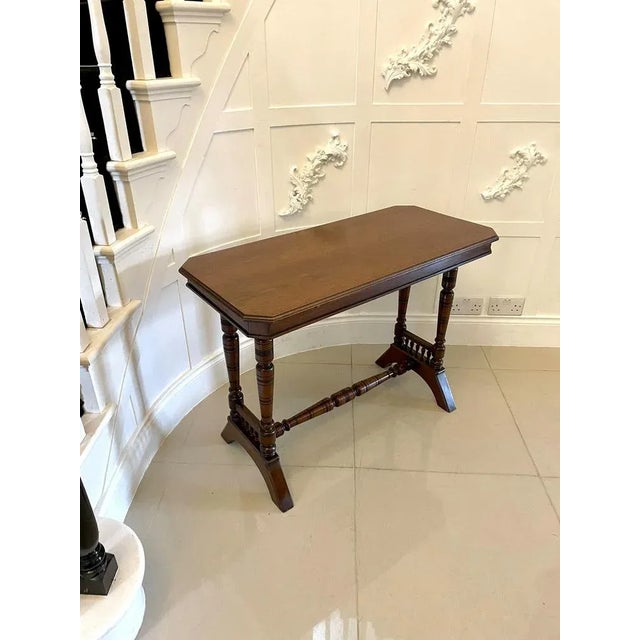 Antique Victorian quality walnut side/lamp table having a quality walnut top with a moulded edge supported by turned...