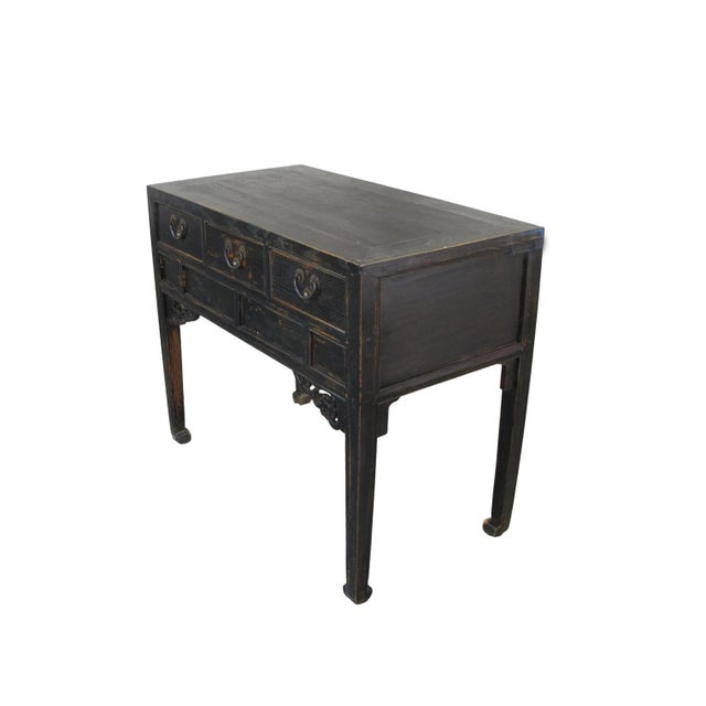 This 19th century elegant console table features a classic three-drawer configuration, each fitted with traditional brass...