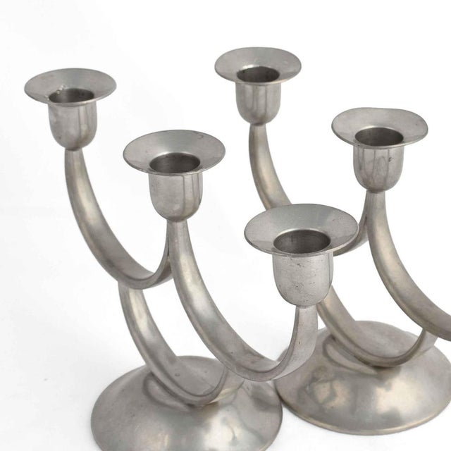 Pair of vintage Art Deco candelabras is a pair of original decorative objects realized in the 1930s. Designed by Harald...