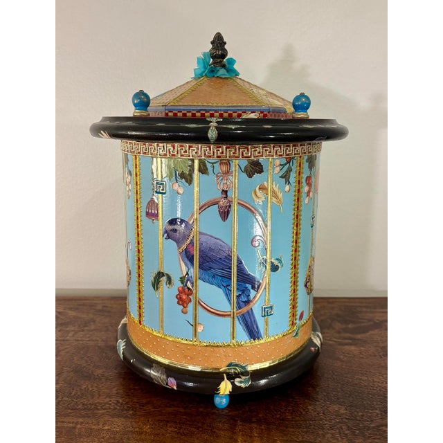 A whimsical and beautifully handcrafted decorative box featuring an elaborate faux birdcage design with richly layered...
