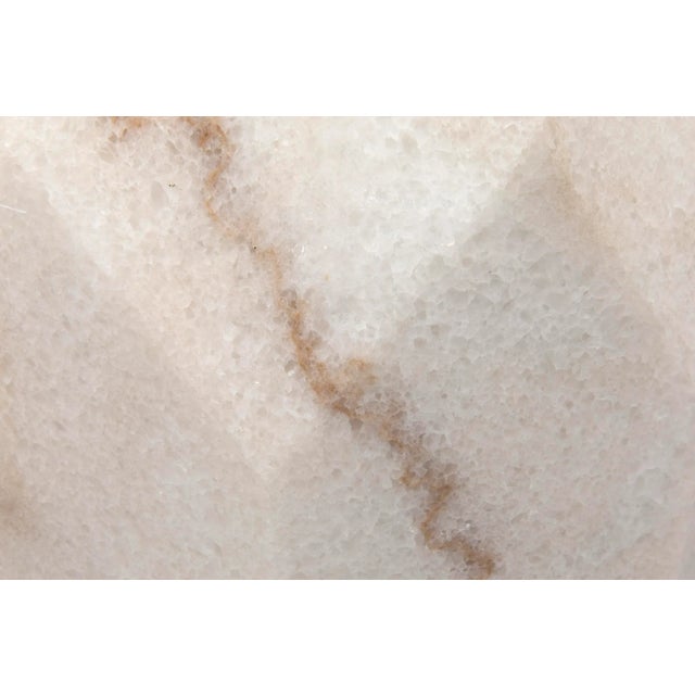 Hand-carved from marble, this imposing accent table makes an opulent and stylish addition to a contemporary decor. No two...