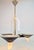 Modernist chandelier from the 1970s, crafted from brass and tempered acrylic iglass in the Regency style. This beautifully...
